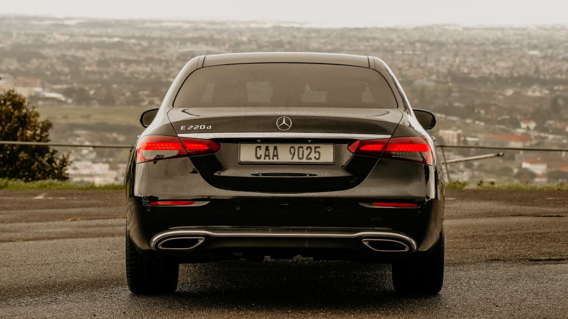 Mercedes-Benz E-Class rear view with city in the background